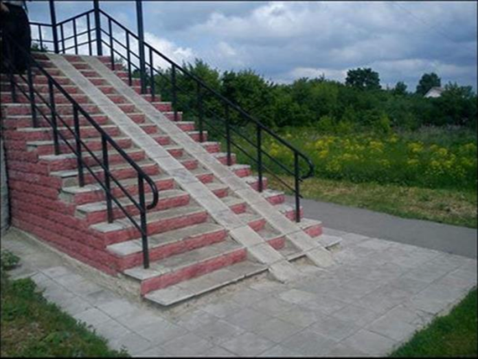 Poorly fitted access ramp on a staircase — an example of an ineffective integrative solution